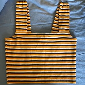 A crop top from Cotton On. Orange, white, and black stripped. Never worn.
